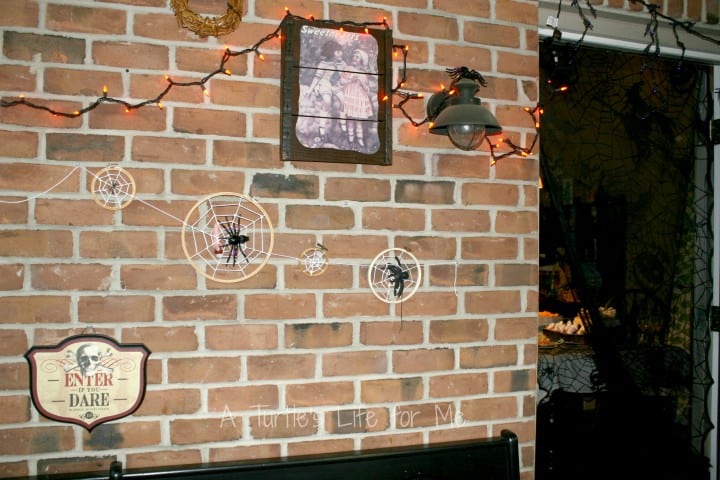 halloween birthday party decorations of orange lights on a brick wall