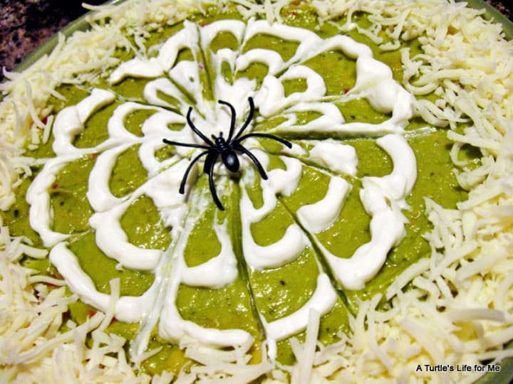 halloween dip appetizer snack recipe. 7 layer dip decorated like a spider web