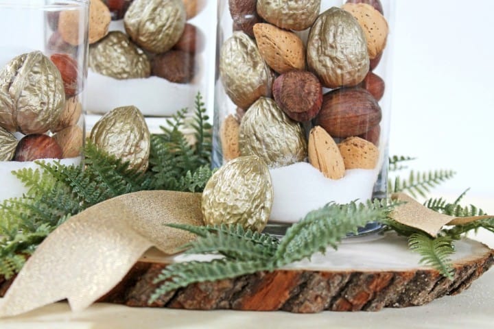This is such an easy idea for holiday decorations and would come together so quickly! Definitely doing this with some Dollar Store candleholders and gold- painted nuts! 