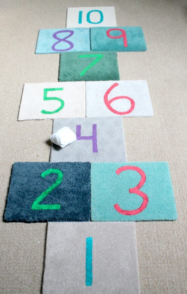 Make an indoor hopscotch set for your kids using $1 carpet tiles and craft paint!