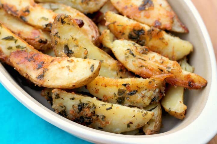 Parmesan Baked Potatoe Wedges. These are so EASY to make and the whole family will love them! My kids gobble them up!