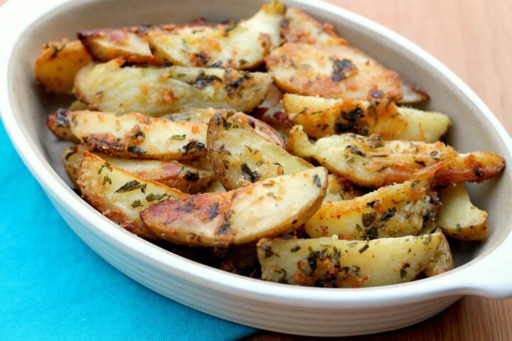 Parmesan Baked Potatoe Wedges. These are so EASY to make and the whole family will love them! My kids gobble them up!