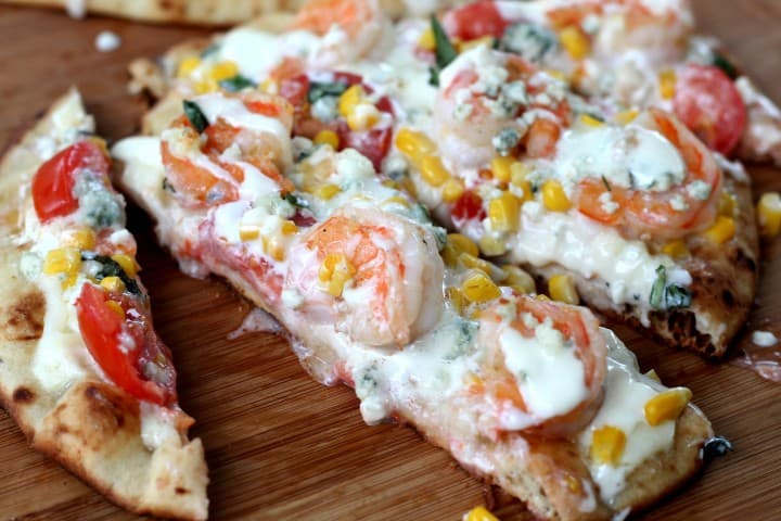 Fresh grilled shrimp pizza loaded with garden veggies and bleu cheese dressing! So easy and so delicious! This is perfect for summer!