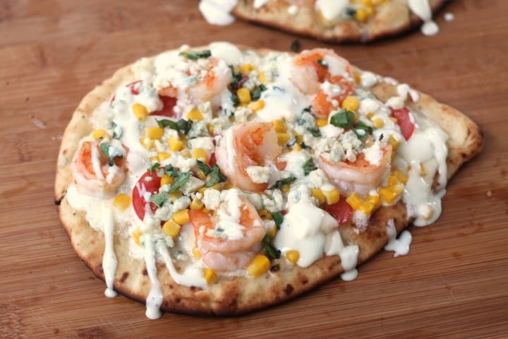 This grilled shrimp pizza with fresh veggies and bleu cheese dressing is amazing and so easy!